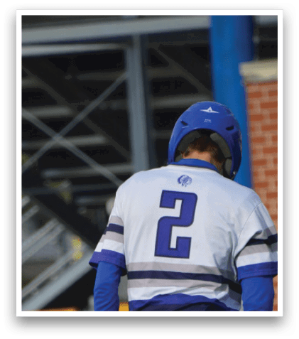 Two baseball players standing on the field. Description generated by AI