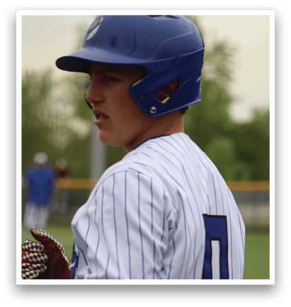 A baseball player wearing a blue and white uniform. Description generated by AI