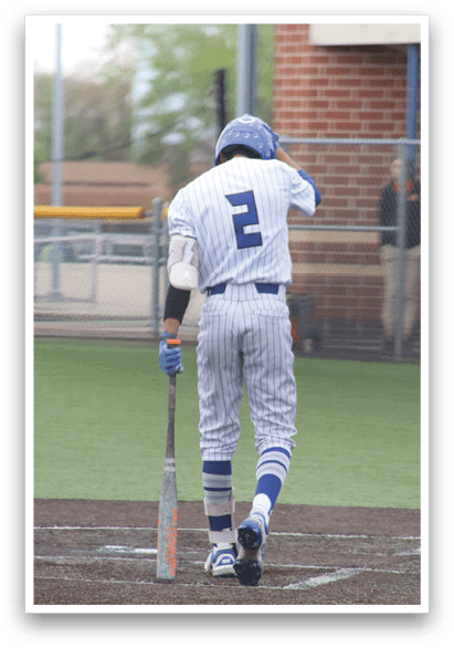 A baseball player with the number 2 on his jersey. Description generated by AI