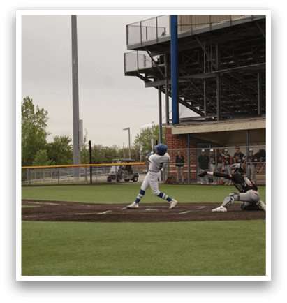 A baseball game is taking place with a batter swinging a bat. Description generated by AI
