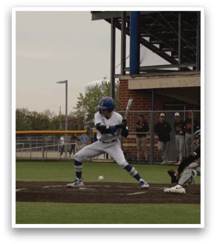 A baseball player is getting ready to hit a ball. Description generated by AI