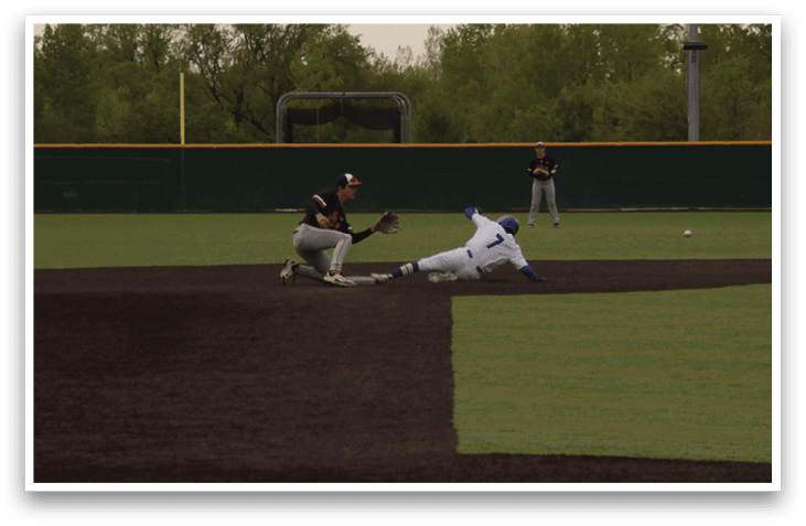 A baseball player slides into home plate. Description generated by AI