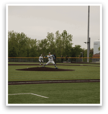 A baseball player is pitching a ball on a field. Description generated by AI