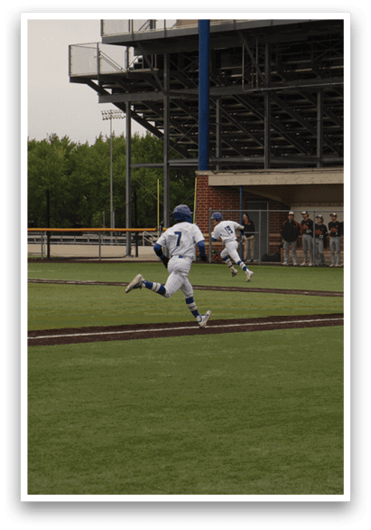 A baseball player running to first base. Description generated by AI