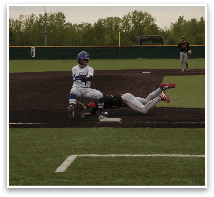 A baseball player slides into home base. Description generated by AI