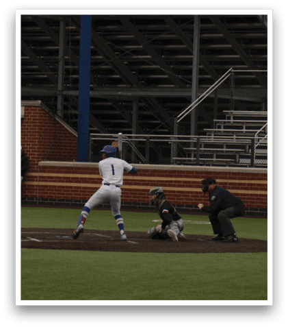 A baseball game is being played on a field with a crowd of people watching. Description generated by AI