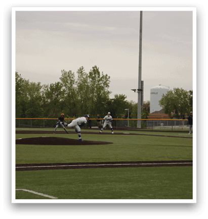 A baseball game is taking place on a field with a man in a blue helmet swinging a bat. Description generated by AI