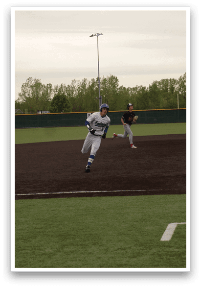 A baseball player is running to the base. Description generated by AI