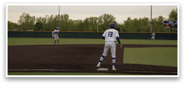 A baseball player is standing on the field with his glove on. Description generated by AI