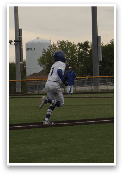 A baseball player running on the field. Description generated by AI