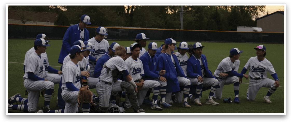 Baseball players wearing blue and white uniforms. Description generated by AI