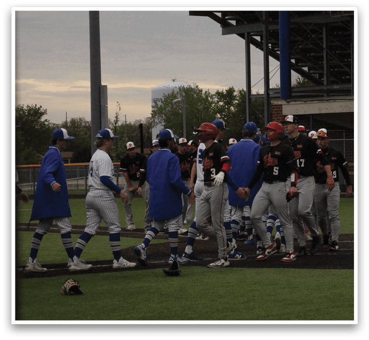 A group of baseball players on a field. Description generated by AI