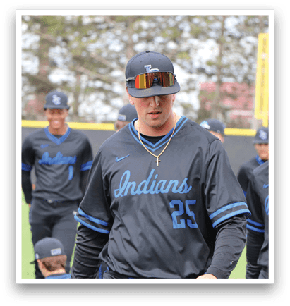 A man wearing a black and blue jersey with the number 26 on it. Description generated by AI