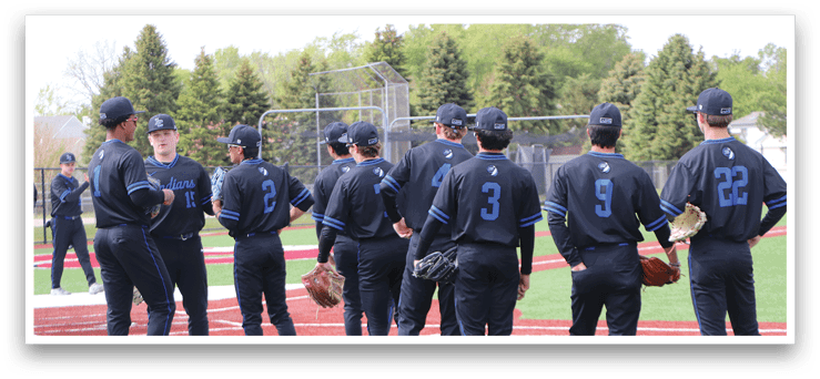 Baseball players wearing black uniforms and blue numbers. Description generated by AI