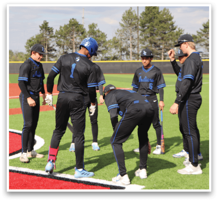 A group of baseball players on a field. Description generated by AI