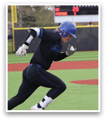 A baseball player running towards home plate. Description generated by AI