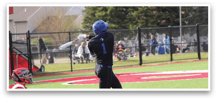 A baseball player in a black shirt and blue helmet is swinging a bat. Description generated by AI