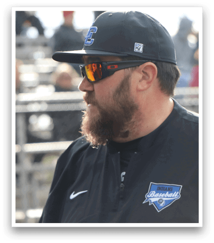 A man wearing a baseball cap and sunglasses. Description generated by AI