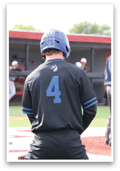 A baseball player wearing a blue and black jersey with the number 4 on it. Description generated by AI