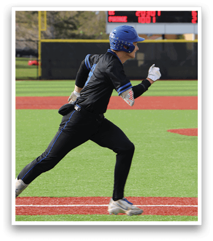 A baseball player in a black uniform is sliding into a base. Description generated by AI
