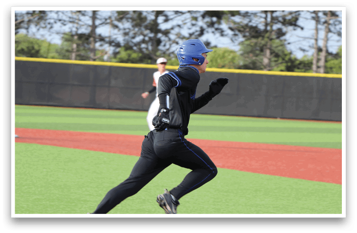 A person running on a baseball field. Description generated by AI
