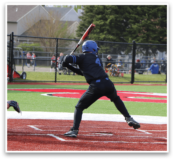 A baseball player is swinging a bat at a ball. Description generated by AI