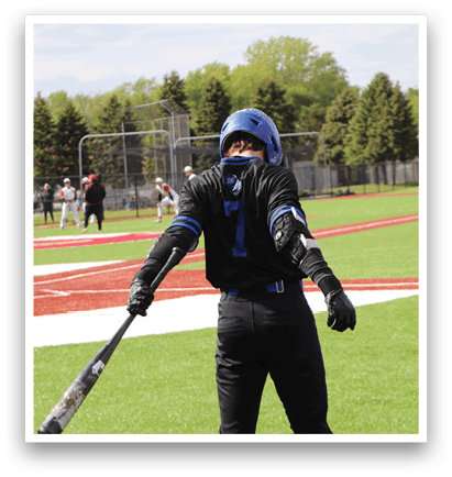 A baseball player with the number 14 on his back is holding a bat. Description generated by AI
