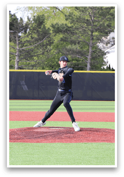 A baseball player in a black shirt and black pants is pitching a ball. Description generated by AI