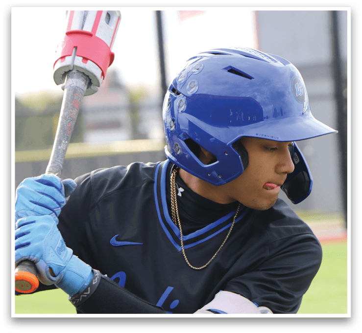 A baseball player wearing a blue helmet and black shirt. Description generated by AI