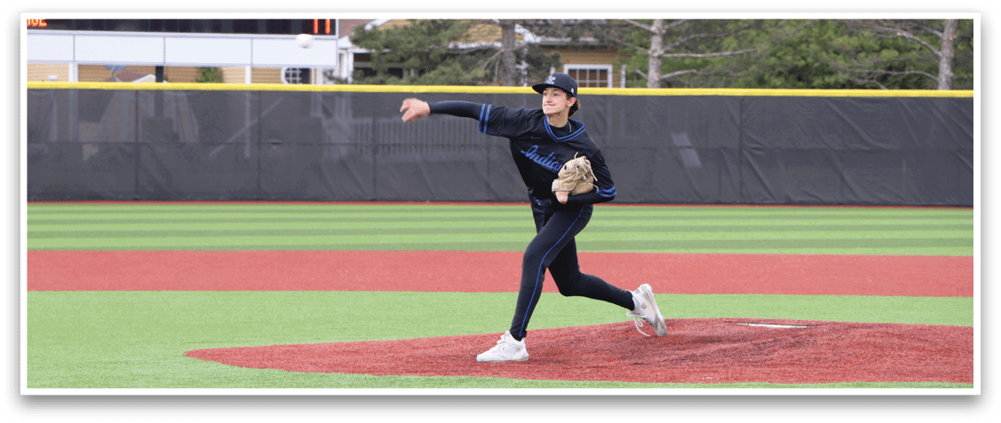 A baseball player in a blue shirt and black pants is pitching a ball. Description generated by AI