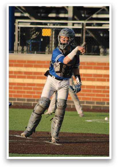 A baseball player wearing a blue shirt and white pants. Description generated by AI
