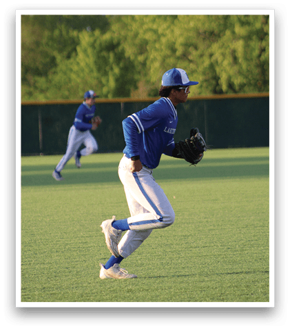 A baseball player in a blue and white uniform is sliding into a base. Description generated by AI
