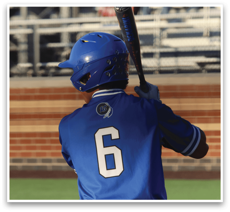 A baseball player is holding a bat and getting ready to swing. Description generated by AI