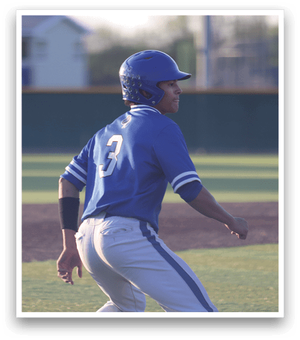 A baseball player wearing a blue shirt and blue hat. Description generated by AI