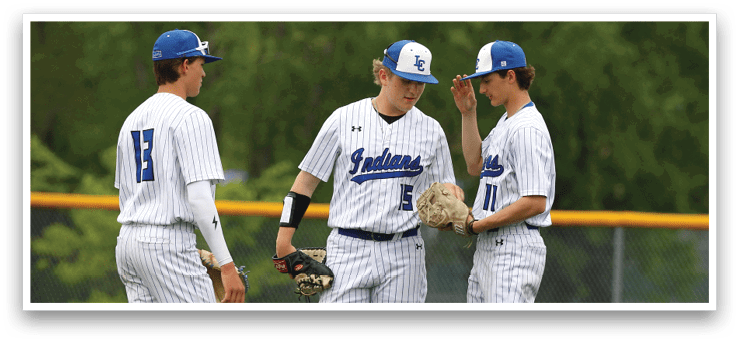 Three baseball players wearing blue and white uniforms. Description generated by AI
