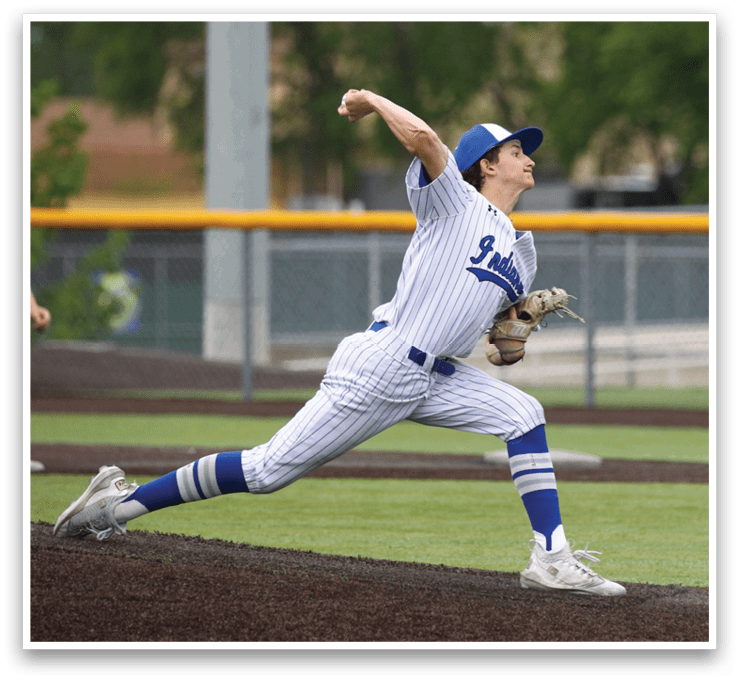 A baseball player in a white and blue uniform is throwing a ball. Description generated by AI