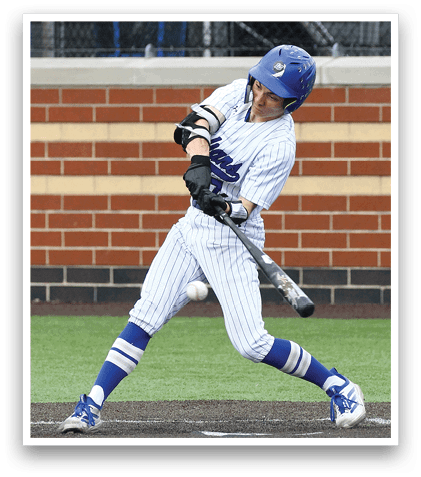 A baseball player in a blue helmet and white uniform is swinging a bat. Description generated by AI