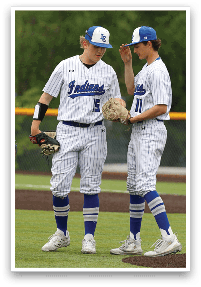 Three baseball players wearing blue and white uniforms. Description generated by AI
