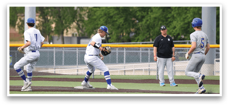Baseball players on a field. Description generated by AI