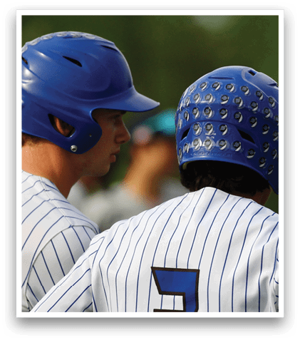 Two baseball players wearing blue helmets. Description generated by AI
