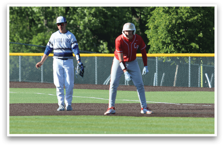 A baseball player is bending over on the field. Description generated by AI