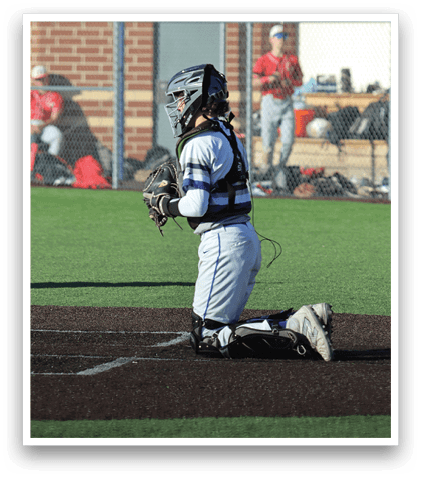 A baseball player is sitting on the ground with a baseball glove on. Description generated by AI
