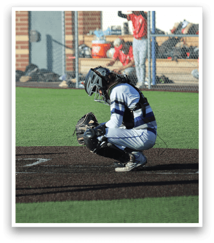 A baseball player is sitting on the ground with a baseball glove on. Description generated by AI