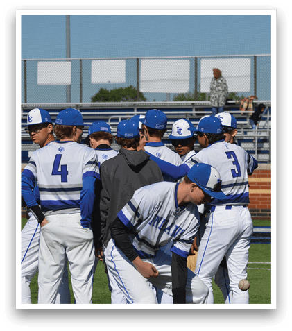 Baseball players wearing blue and white uniforms. Description generated by AI