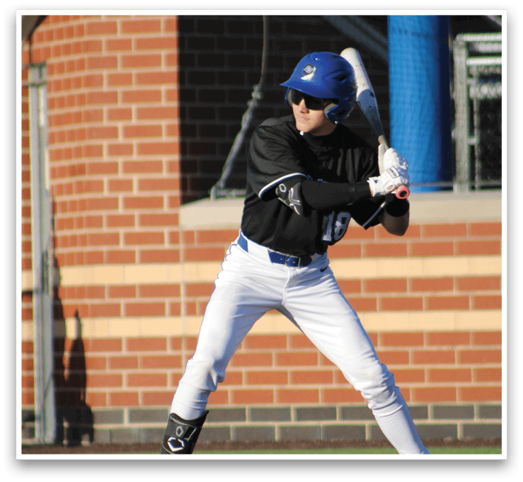 A baseball player in a black and white uniform is swinging a bat. Description generated by AI