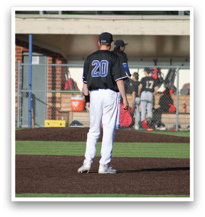 Two baseball players standing on the field. Description generated by AI