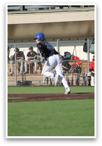 A baseball player in a red shirt is running to the base. Description generated by AI