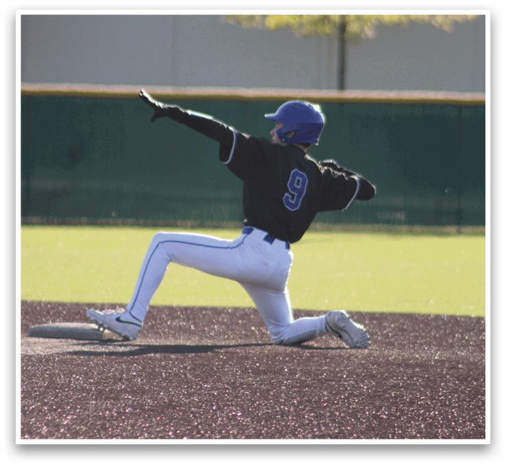 A baseball player sliding into a base. Description generated by AI