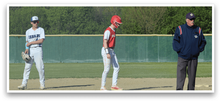 A baseball player wearing a red and white uniform. Description generated by AI