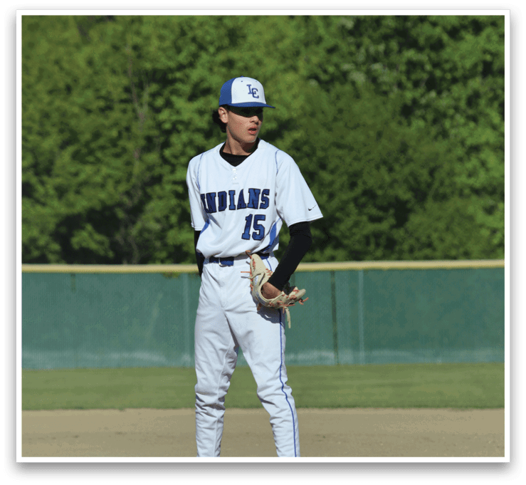 A baseball player is standing on the pitcher's mound. Description generated by AI